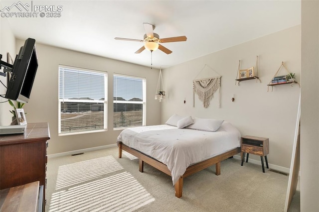 bedroom with light carpet and ceiling fan