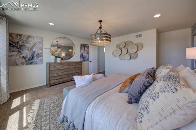 bedroom featuring light colored carpet and a notable chandelier