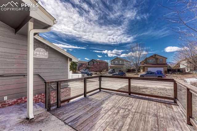 wooden deck featuring a residential view