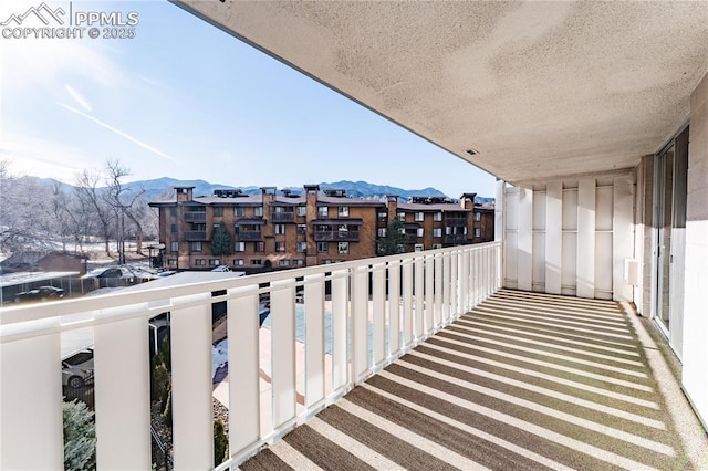 balcony featuring a mountain view