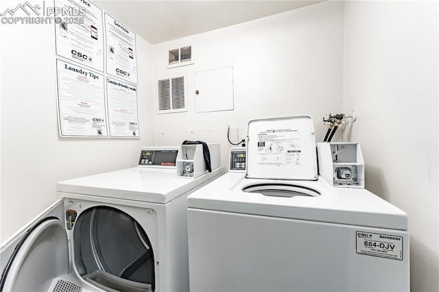 laundry room featuring washing machine and dryer