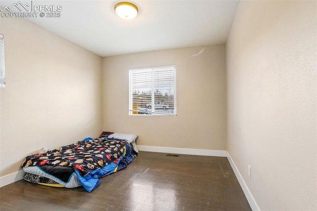 bedroom featuring hardwood / wood-style floors