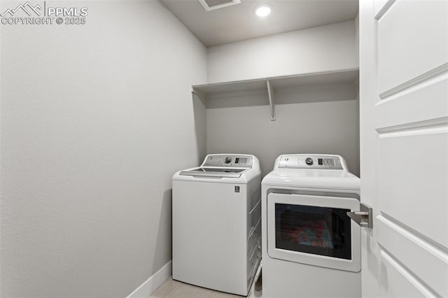 laundry area with washing machine and dryer