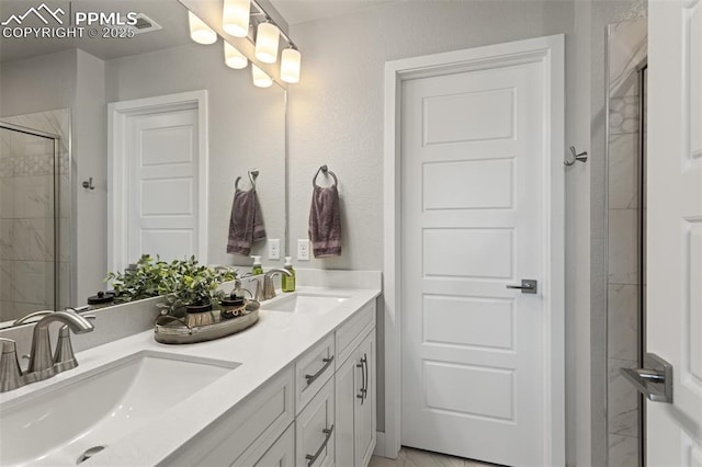 bathroom with vanity and an enclosed shower