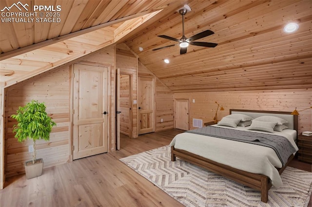 bedroom featuring lofted ceiling, wooden ceiling, wooden walls, and light hardwood / wood-style flooring