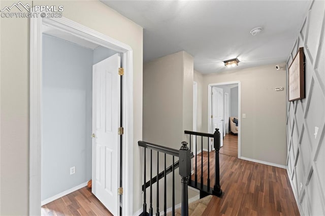 corridor with dark wood-type flooring