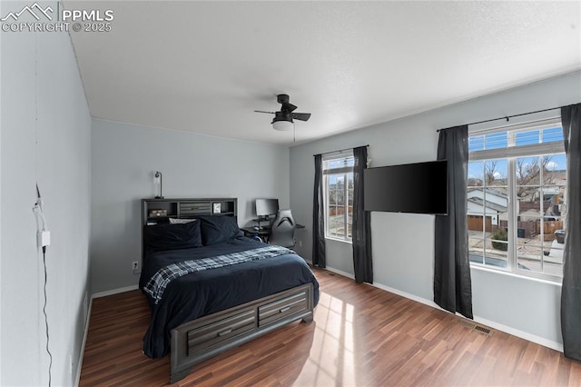 bedroom with ceiling fan and hardwood / wood-style floors