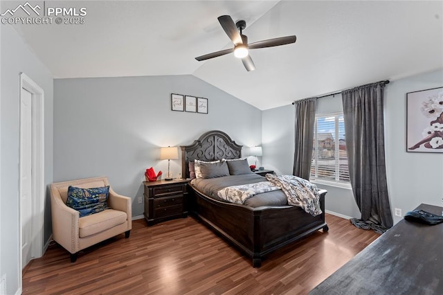 bedroom with vaulted ceiling, ceiling fan, and dark hardwood / wood-style flooring