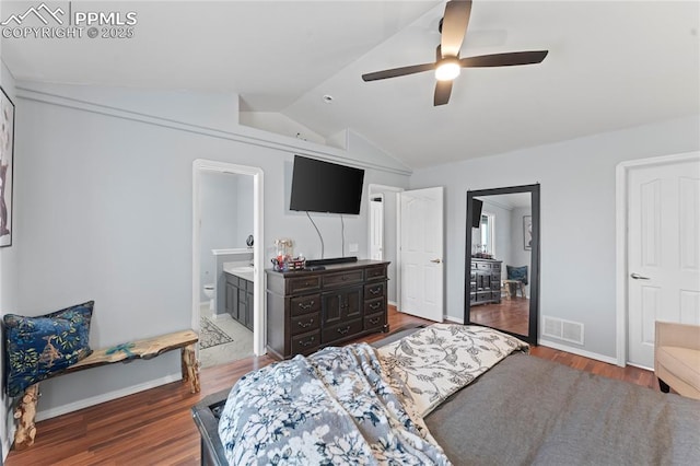 bedroom featuring lofted ceiling, hardwood / wood-style flooring, ensuite bath, and ceiling fan