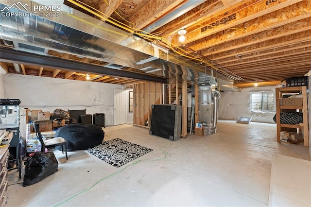 basement featuring heating unit