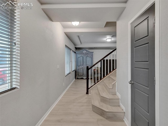 stairs with hardwood / wood-style floors