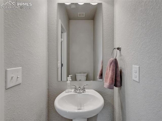 bathroom with sink and toilet