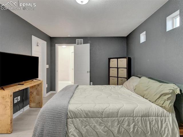 bedroom featuring light hardwood / wood-style flooring