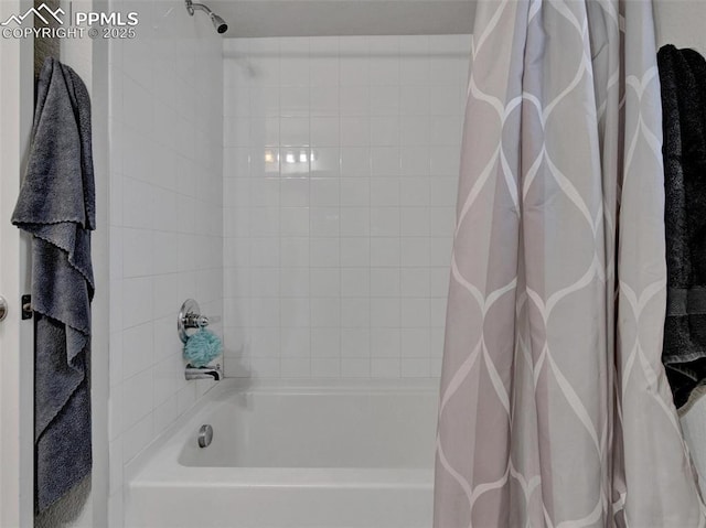 bathroom featuring shower / tub combo with curtain