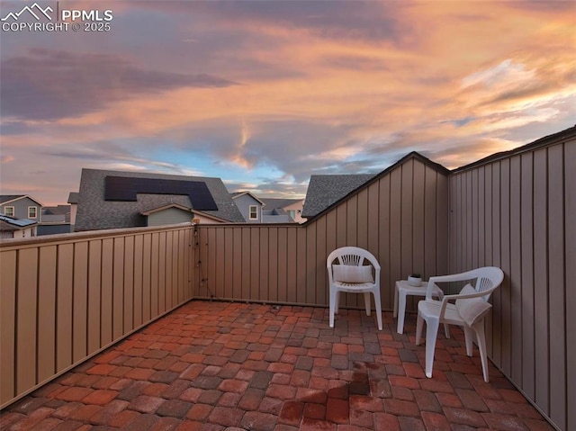 view of patio terrace at dusk