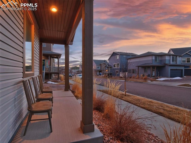 balcony at dusk with covered porch