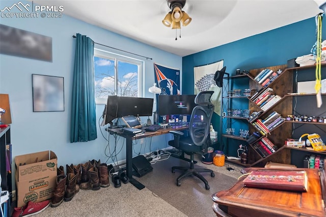 carpeted home office with ceiling fan