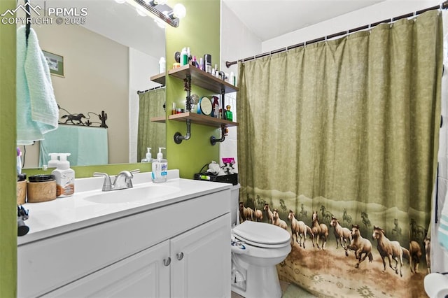 bathroom featuring vanity and toilet