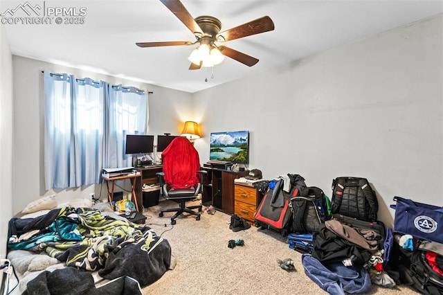 carpeted office featuring ceiling fan