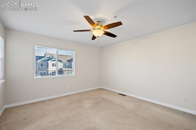 unfurnished room featuring light carpet and ceiling fan