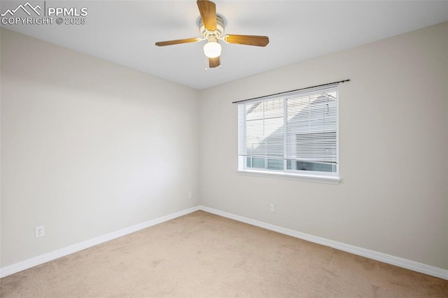 carpeted empty room featuring ceiling fan