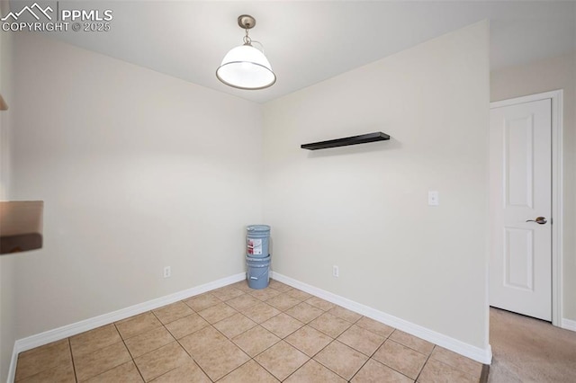 unfurnished room featuring light tile patterned floors