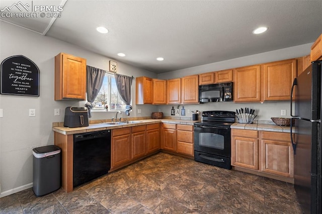 kitchen featuring sink and black appliances