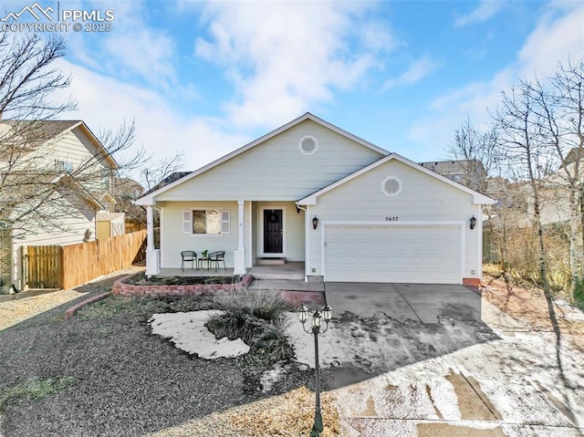 ranch-style house with a porch and a garage