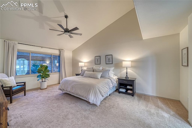 carpeted bedroom with ceiling fan and high vaulted ceiling