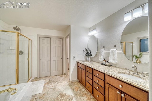 bathroom featuring vanity, independent shower and bath, and backsplash