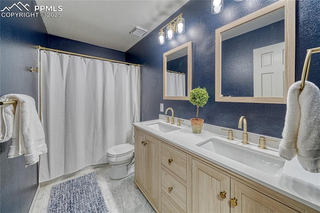 bathroom with vanity, toilet, and a shower with shower curtain