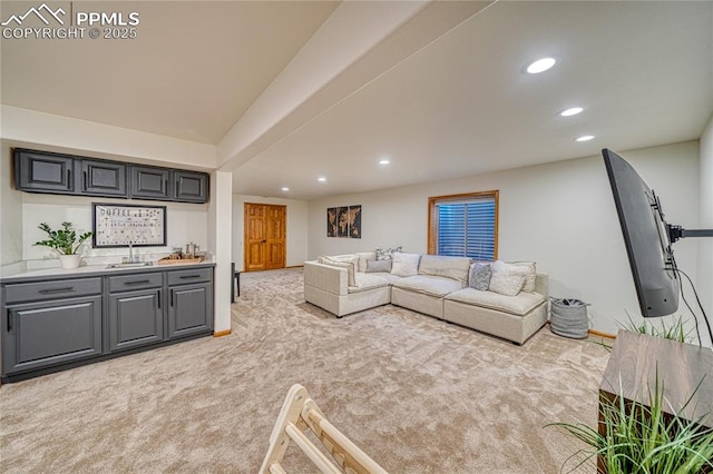 living room featuring light carpet and indoor wet bar