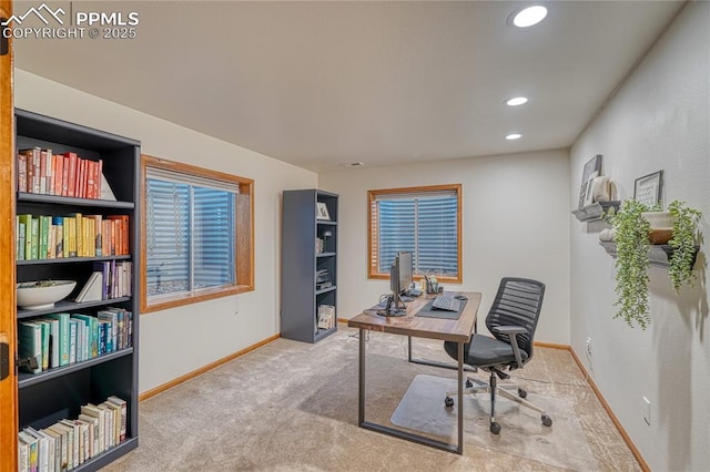 office space with light colored carpet