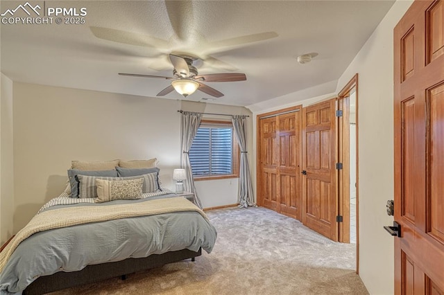 carpeted bedroom featuring ceiling fan