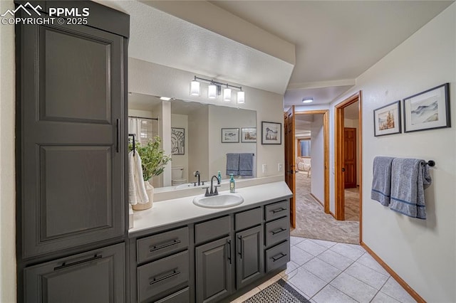 bathroom featuring vanity and tile patterned flooring