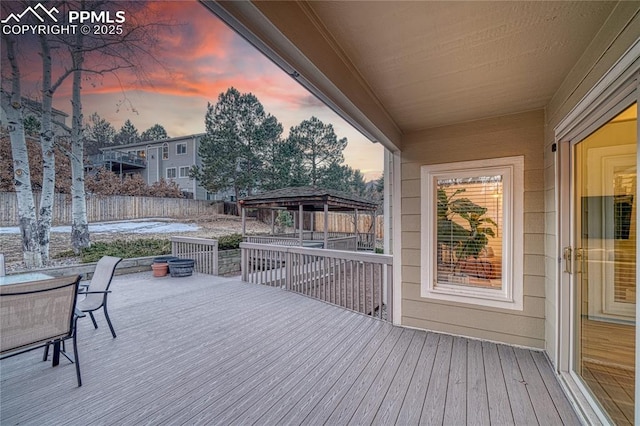 deck at dusk with a gazebo