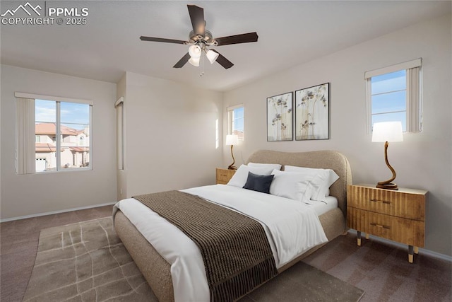 bedroom with ceiling fan and dark carpet