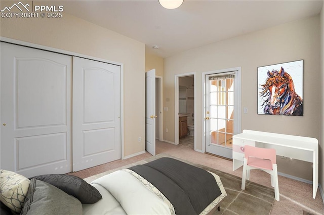 bedroom with ensuite bath, a closet, and carpet