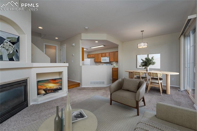 living room featuring light colored carpet