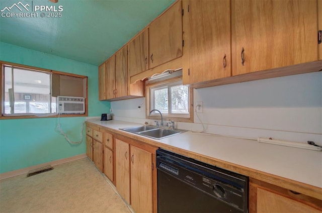 kitchen with black dishwasher, sink, and cooling unit