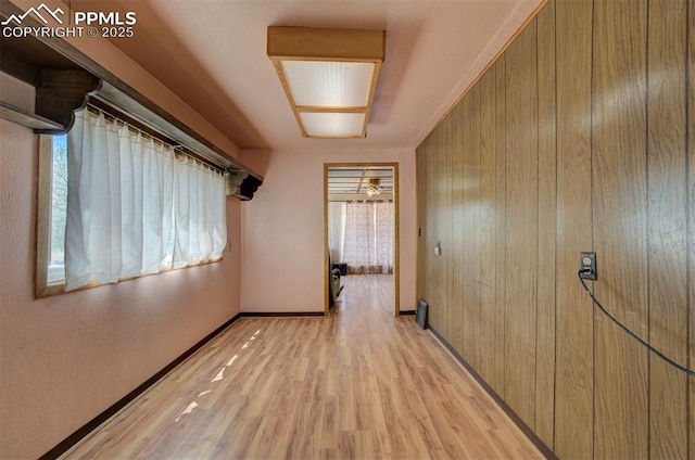 corridor featuring light hardwood / wood-style floors