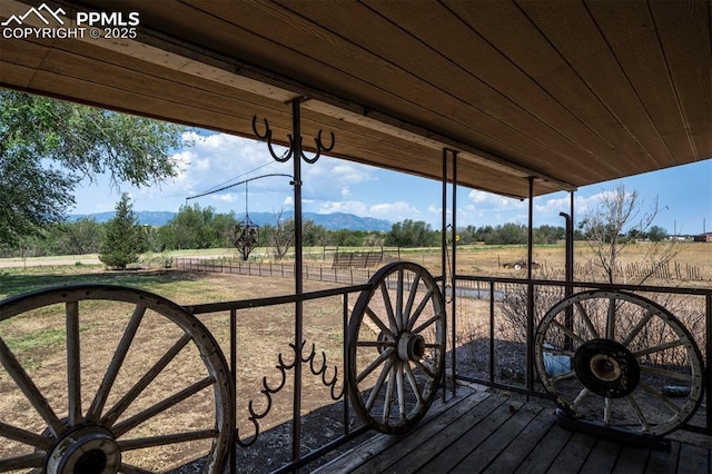 wooden deck featuring a rural view