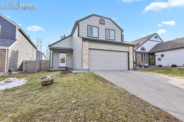 view of property with a garage and a front lawn