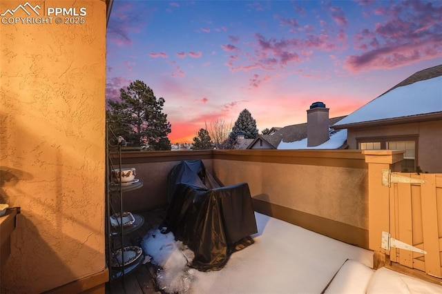 patio terrace at dusk with a balcony