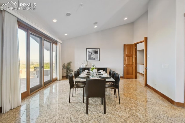 dining area featuring high vaulted ceiling and french doors