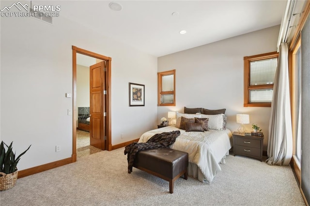 bedroom featuring light colored carpet