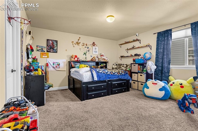 bedroom with light carpet and a textured ceiling