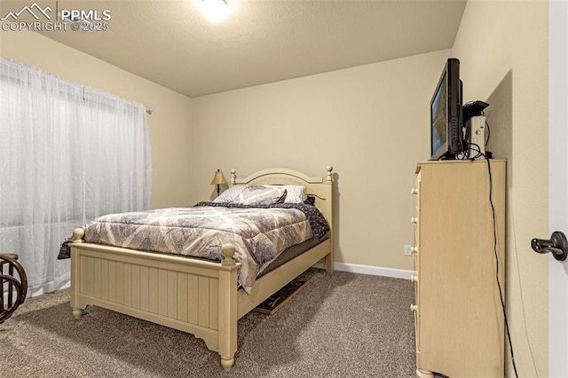 carpeted bedroom featuring baseboards