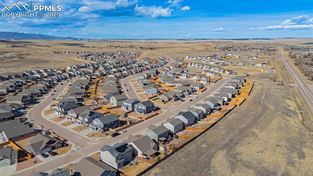 drone / aerial view featuring a mountain view and a residential view