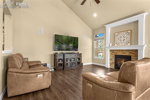 living area featuring high vaulted ceiling, dark wood-style flooring, a fireplace, and baseboards